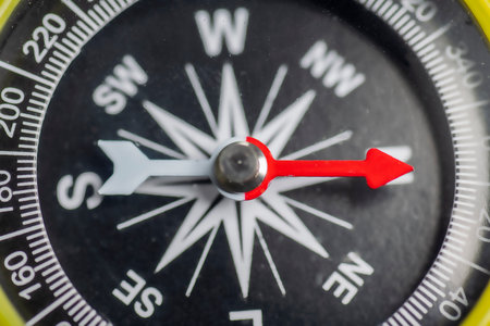 Closeup view of navigational compass on black background. Travel guidance equipmentの写真素材