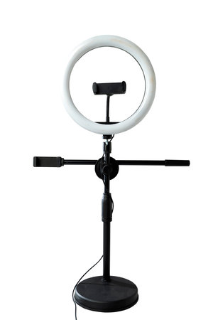 Round LED ring light with a phone holder isolated over a white background. Vlogging or live streaming equipmentの写真素材