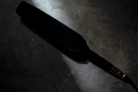 Studio microphone for podcasting or streaming with a black background. Top viewの写真素材
