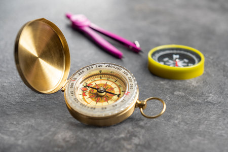 Closeup view of navigational compass and pink compasses. Travel guidance equipmentの写真素材