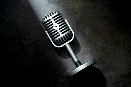 Vintage silver microphone with a black background. Top viewの写真素材