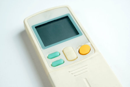 Modern remote control air conditioner on a white backgroundの写真素材