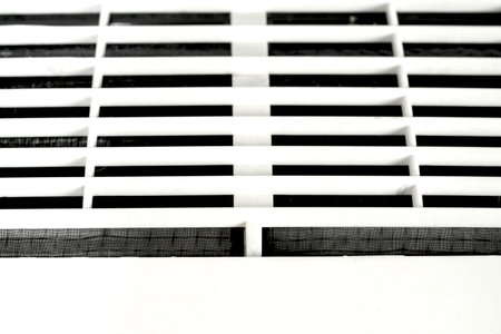 Closeup view of an Air conditioner or AC indoors on a white wall backgroundの写真素材