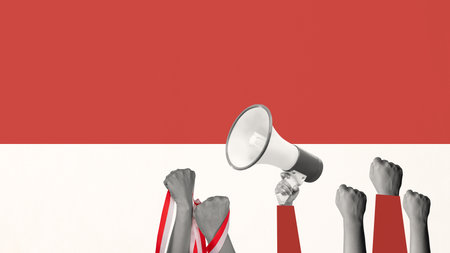 Human hand holding a megaphone and the Indonesian flag to celebrate Indonesia Independence Day. Collage art. Concept of Kemerdekaanの写真素材