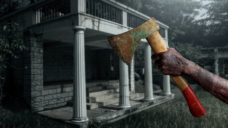 Zombie hand with a bloody wound holding an axe haunted the old building. Zombie, devil, evil, satan, or monster hands. Concept of Spooky Halloweenの写真素材