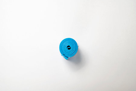 Closeup view of a blue rolled band isolated over a white backgroundの写真素材