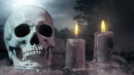 Human head skull with fire candles for ritual at a scary night scene background. Concept of Spooky Halloweenの写真素材