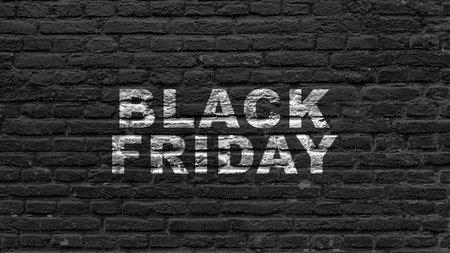 Closeup view of Black Friday text on a black wall background. Copy space. Flat lay. Black Friday sale conceptの写真素材