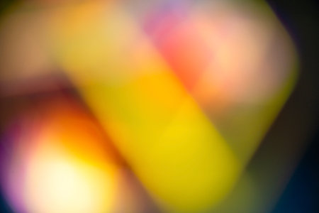 A soft and vibrant abstract background featuring a gradient of blurred colors and light leak effects. Texture or background in various designsの写真素材
