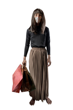 Indonesian southeast asian man dressed as a woman wearing a bloody face mask and holding bloody shopping bags isolated over a white background. Concept of Halloween, Sister Hong, or red uncleの写真素材