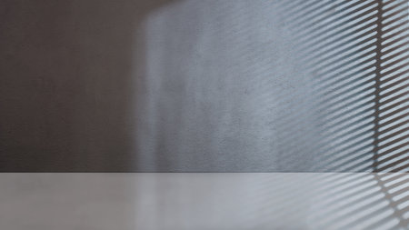 Striking light beam shines across the interior of the room with concrete walls. Mockup, copy space, or template. Empty backdrop podium for product or text displayの写真素材