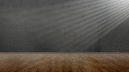 Striking light beam shines across the interior of the room with concrete walls and a wooden floor. Mockup, copy space, or template. Empty backdrop podium for product or text displayの写真素材