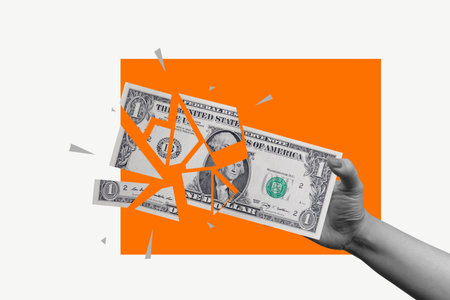 Human hand holding a ripped dollar banknote on a colored background. Collage art of the Economyの写真素材
