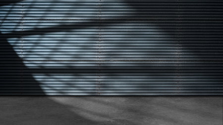 Dramatic shadow of window light shines across the interior of the room with metal walls and a concrete floor. Mockup, copy space, or template. Empty backdrop podium for product or text displayの写真素材