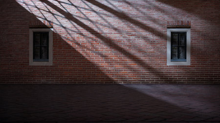 Dramatic shadow of window light shines across the interior of the room with red brick walls and a tile floor. Mockup, copy space, or template. Empty backdrop podium for product or text displayの写真素材