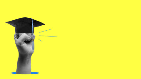 Human hand raised an arm to the air with graduation caps on it with a colored background. Collage art of Graduationの写真素材