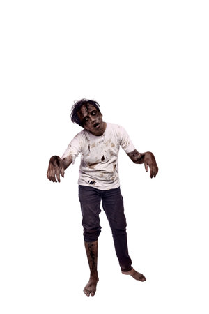 Portrait of an Indonesian southeast asian male zombie with a wound and blood on the body isolated over a white background. Spooky expression. Concept of Halloween or Horrorの写真素材