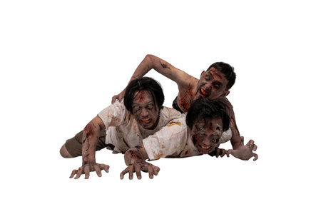 Portrait of three Indonesian southeast asian scary male zombies with wounds and blood on their bodies isolated over a white background. Spooky expression. Concept of Halloween or Horrorの写真素材