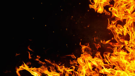 Dramatic red, orange, yellow flame and smoke rising against a dark background. Realistic, abstract fire burning background texture overlay. Vivid and hot blazing fire wallpaperの写真素材