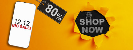 12.12 big sale text on cellphone screen with up to 80% text on the label tag. Copy space. Flash sale conceptの写真素材