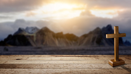 Christian cross on a wooden table with a landscape view and a dark dramatic sky background. Concept of Christianity, religious, faith, Jesus, or beliefの写真素材