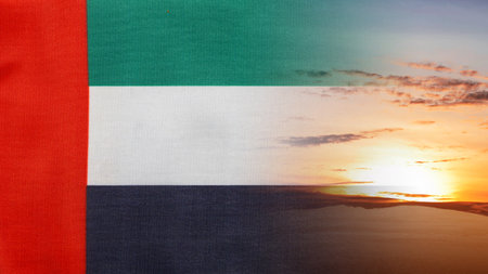 National flag of United Arab Emirates with sunlight background. Concept of UAE national day celebrationの写真素材