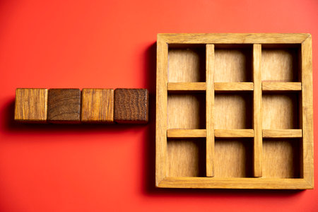 Row of wooden square cubes on colored background. Template or Copy spaceの写真素材