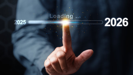 Business hand slides the loading bar from 2025 to 2026 on a virtual screen. Happy New Year concept or Celebrationの写真素材