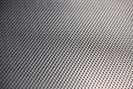 Silver Metallic Background with pattern in diagonal lines and blurred foreground and background.の写真素材