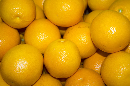a lot of juicy, ripe oranges closeup. orange background の写真素材