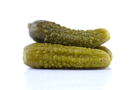 Pickled cucumbers on white backgroundの写真素材
