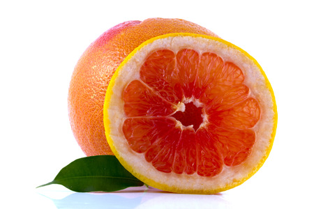 fresh grapefruit with leaves isolated on white backgroundの写真素材