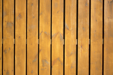 wood texture with natural patterns. Vertical wooden fence close upの写真素材