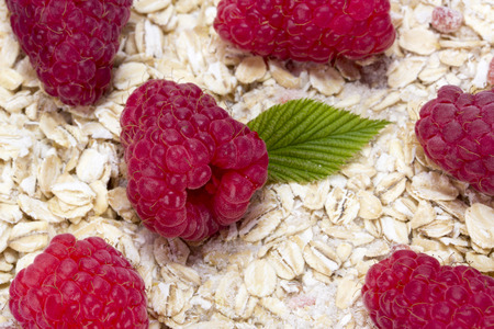 oatmeal with raspberries and leafの写真素材