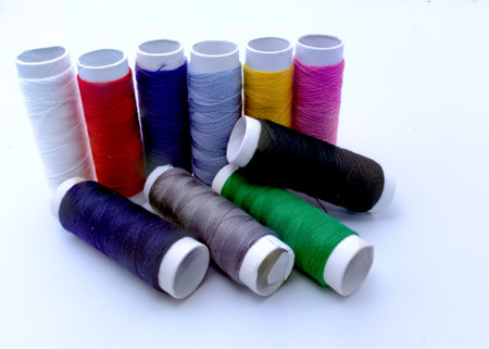 A colorful collection of thread spools for sewing and crafting projects.

Ten spools of vibrant...