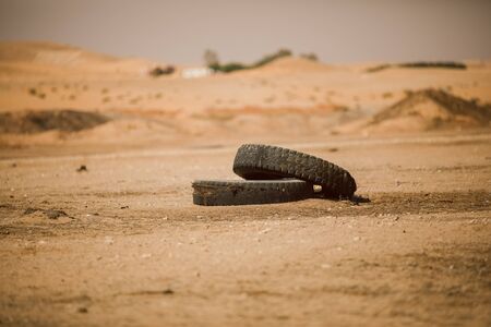 Old tires in desertの写真素材