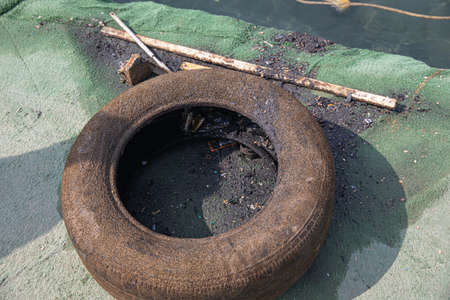 Sea Pollution, waste materials metal, plastic, rubber, industrial wastes thrown inside seaの写真素材