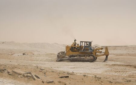 graders at work in Sand field,の写真素材