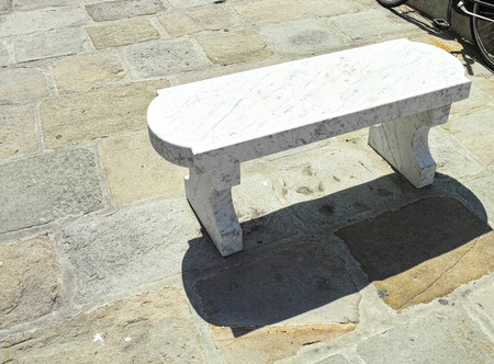 marble bench in a garden in livornoの写真素材
