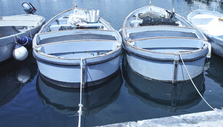 old fishing boat in the harbour of fezzanoの写真素材