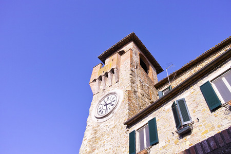 Clock tower in Passignano sul Trasimeno, small town on the homonym lake in the italian region of Umbria.の写真素材