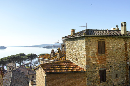 Clock tower in Passignano sul Trasimeno, small town on the homonym lake in the italian region of Umbria.の写真素材