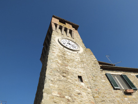 Clock tower in Passignano sul Trasimeno, small town on the homonym lake in the italian region of Umbria.の写真素材