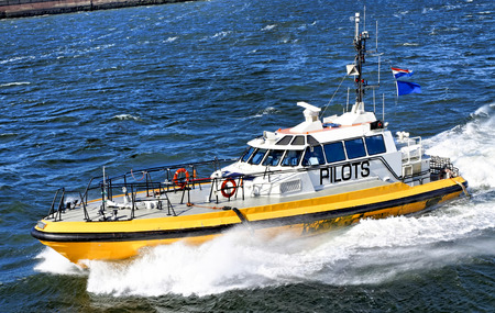 pilot boat in navigation in a windy dayの写真素材