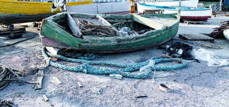 old wooden fishing boat in a harbour in la speziaの写真素材