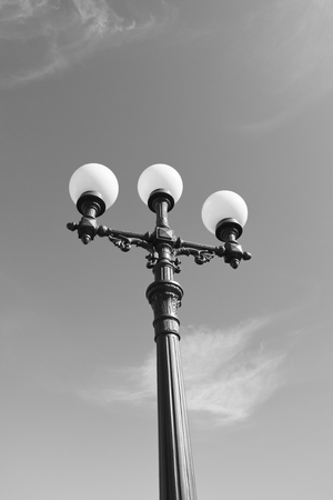 old street lamps in naples against a lue skyの写真素材