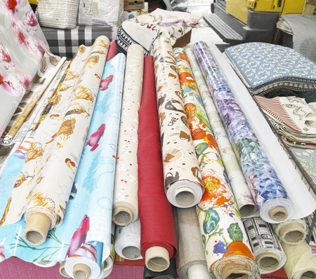 Rolls of colorful fabric in a market during my voyage