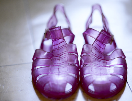 detail of violet plastic sandal in my houseの写真素材