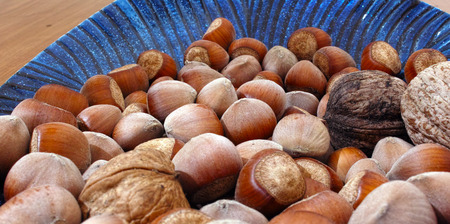 close up of plenty hazelnut in a dish