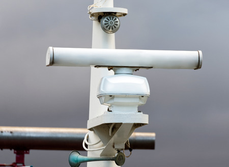 detail of a fishing boat radar in a harbourの写真素材